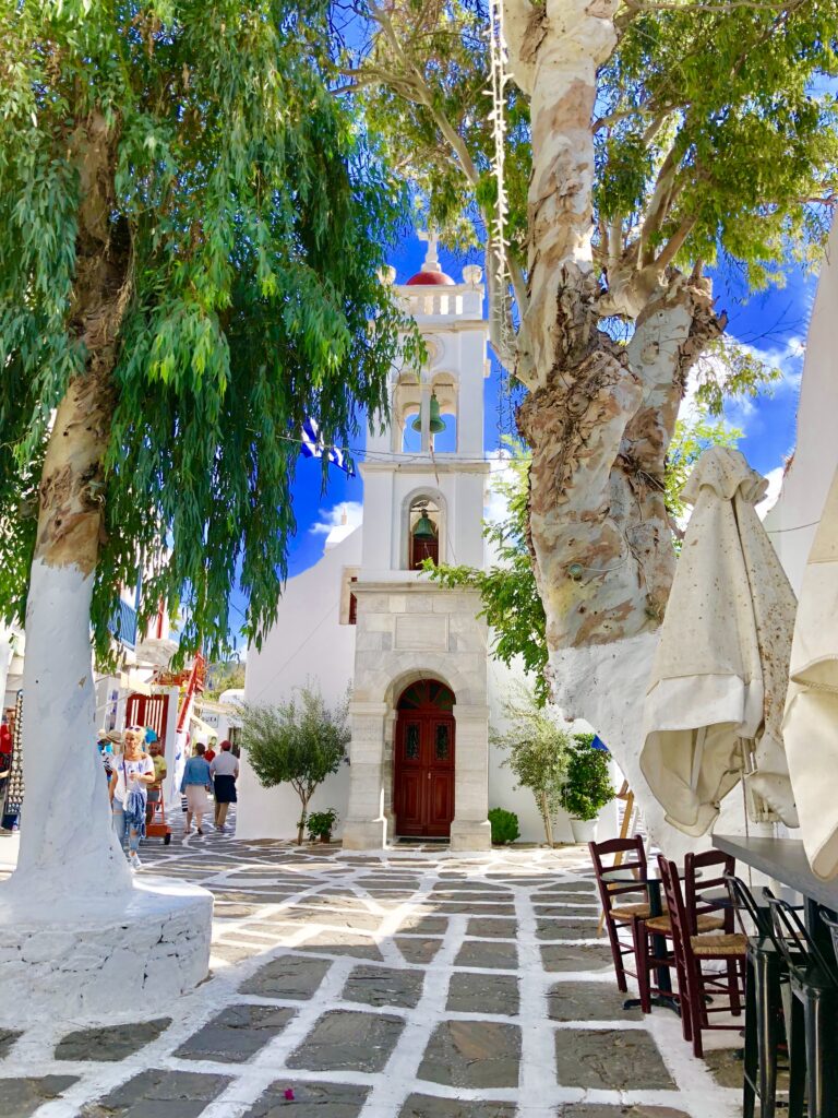 White church and bell tower in Mykonos Greece