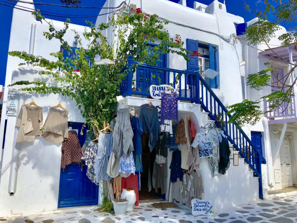 Whitewashed buildings with blue doors and balconies in Mykonos Greece