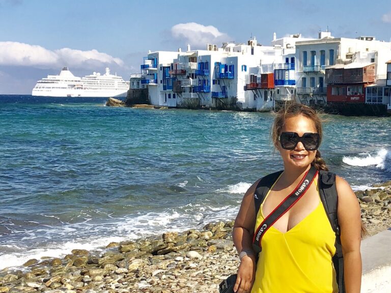 Visiting Mykonos Greece with white waterfront buildings and the Aegean Sea