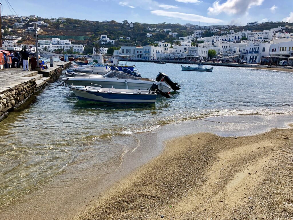 Mykonos Greece harbor with boats and whitewashed buildings along the waterfront